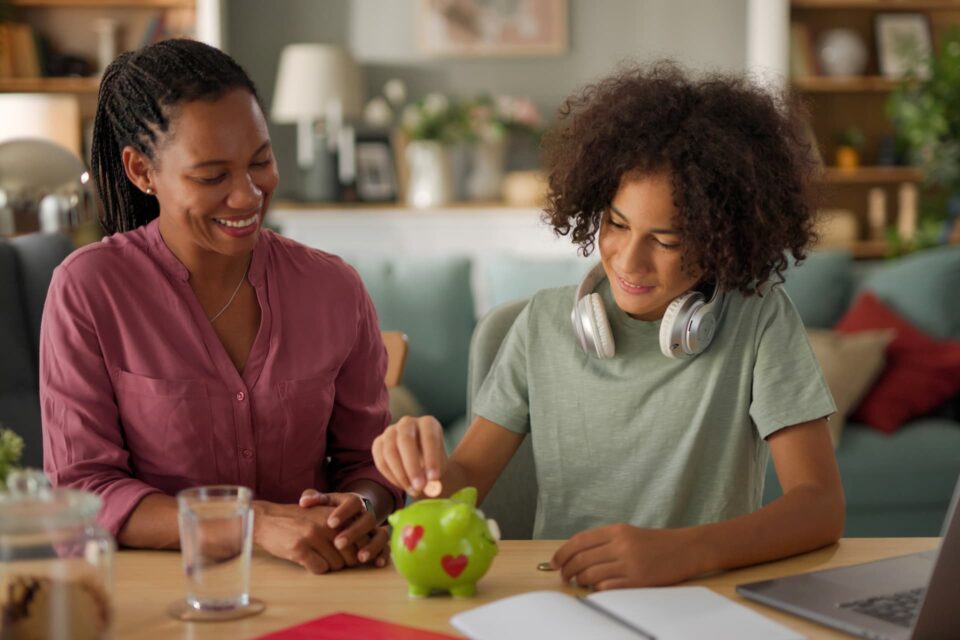 A mother teaching her child about financial literacy