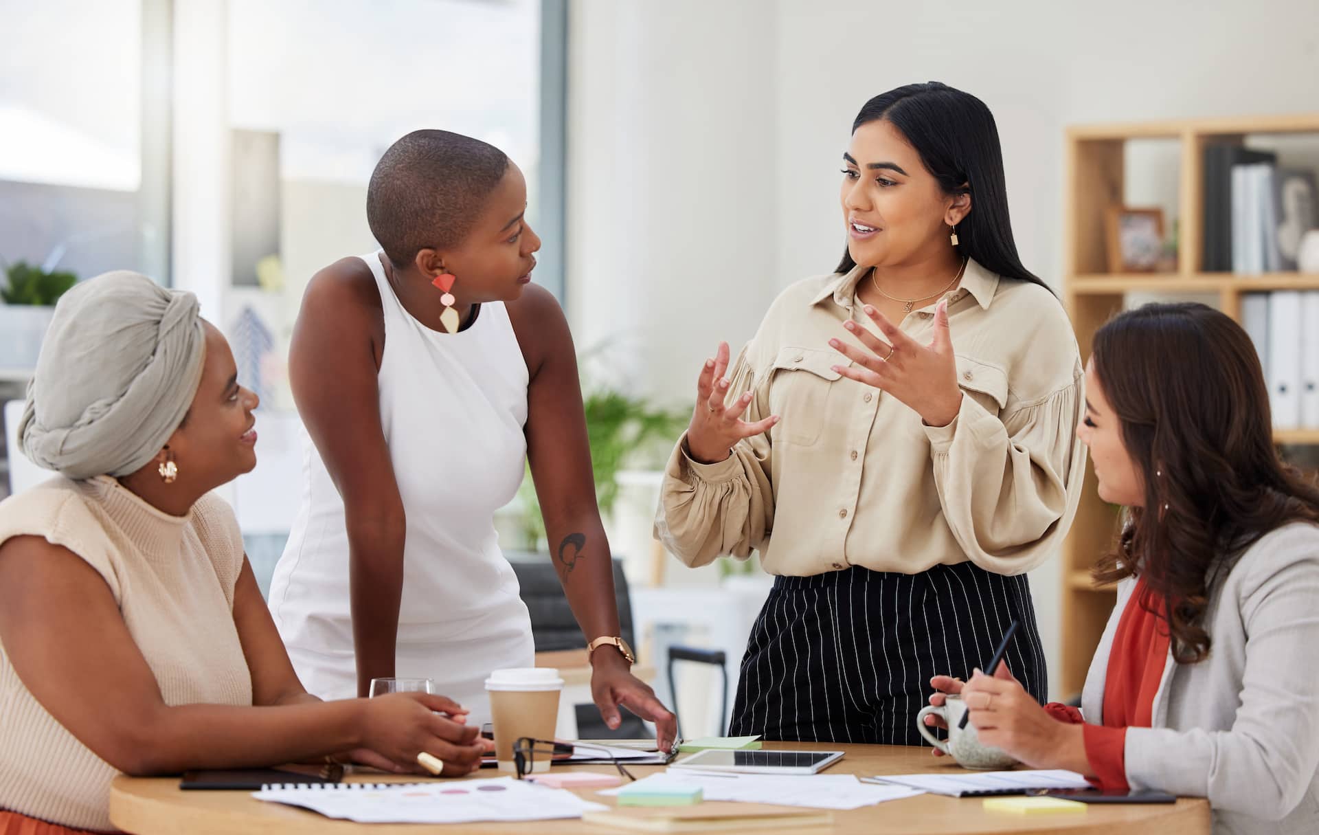 A group of agents gathered around a table discussing contract negotiation