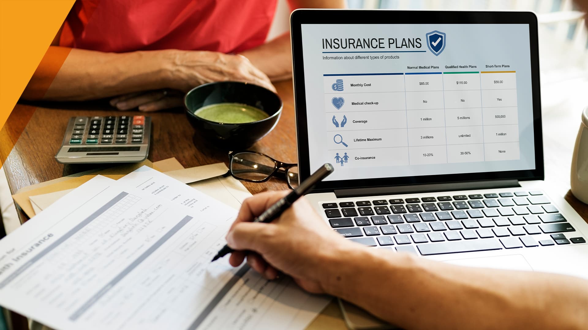 Person researching and comparing health insurance plans on a laptop surrounded by documents, calculator, and coffee.