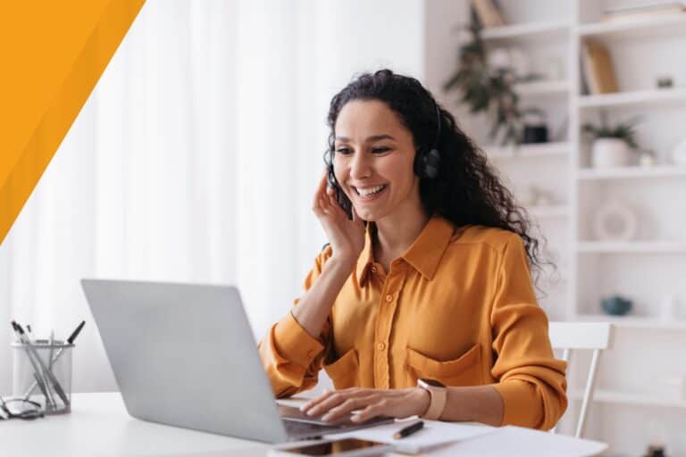 Woman in headset conducting virtual insurance webinar from home.